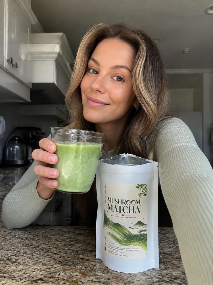 Iced mushroom matcha latte beside the bag on a kitchen counter